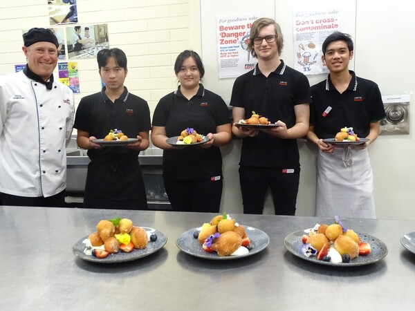 students with donuts for service (Large).JPG