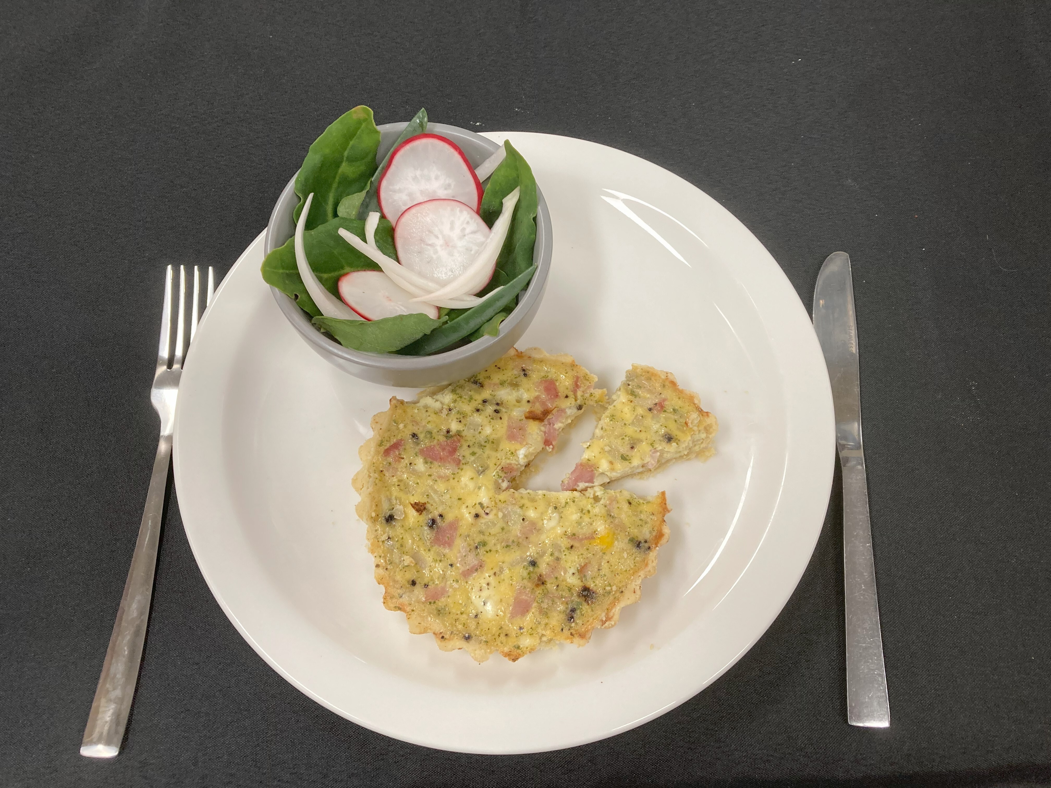 Saltbush, Pepperberry and Goat Cheese Quiche served with Warrigal Greens and Karkalla.jpg